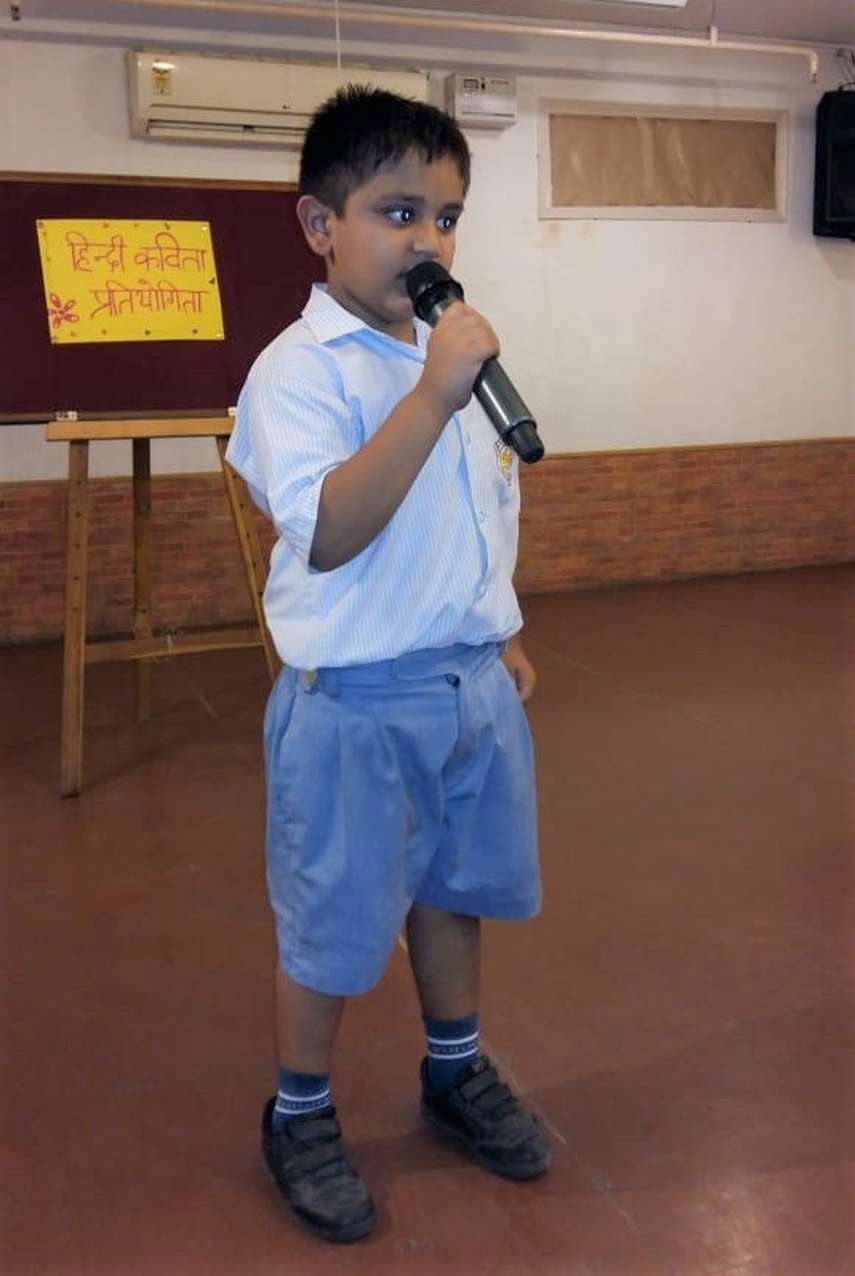 Madhav Goel of class I encouraged the students to save the environment 
